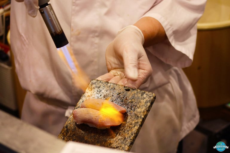 Blow-torched salmon sushi on a Tokyo food tour