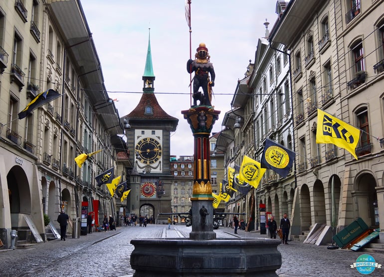 Zytglogge clock tower street in Bern, decorated with festival flags