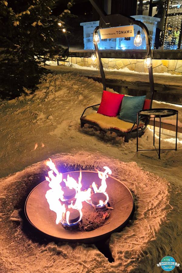 Fire pit and seating in the snow on Hotalu Street, Hoshino Resorts Tomamu
