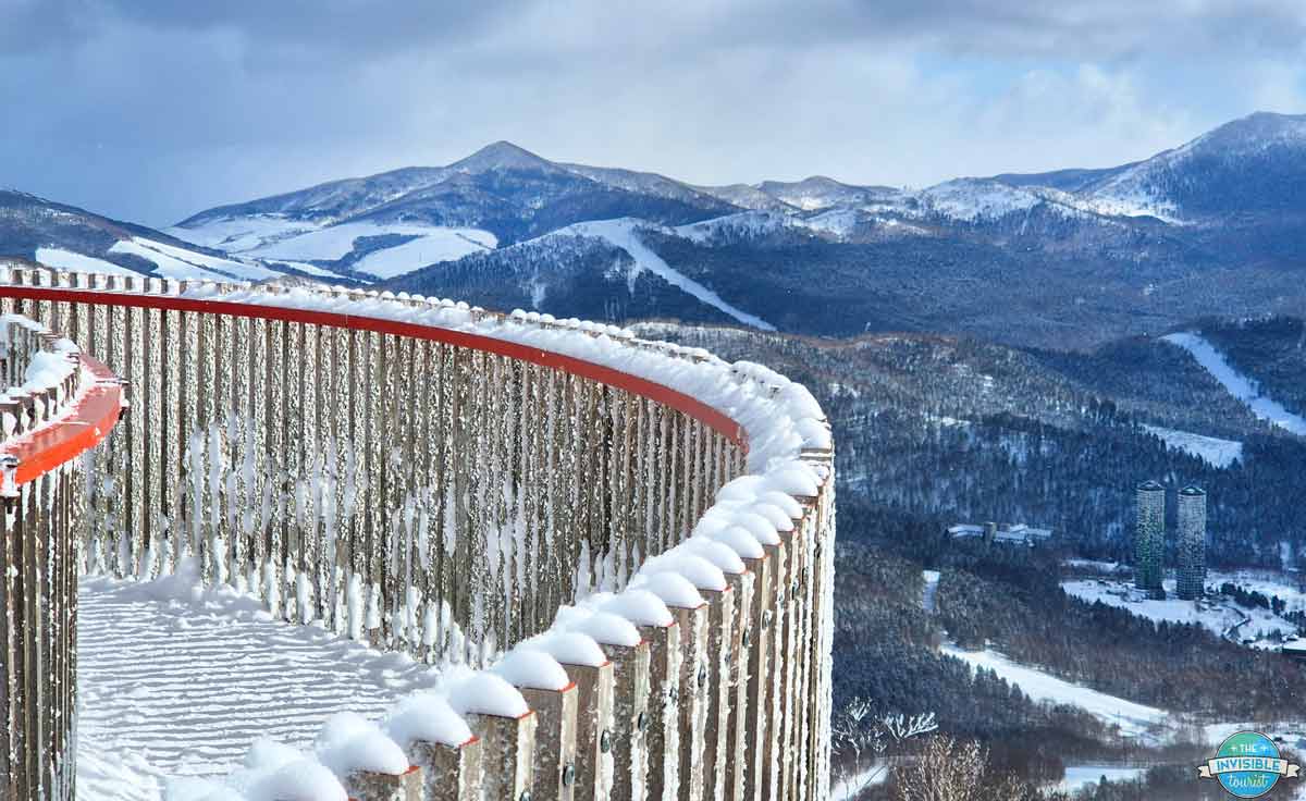 Snow covered curved lookout with mountain views at the Terrace of Frosted Tree, Tomamu