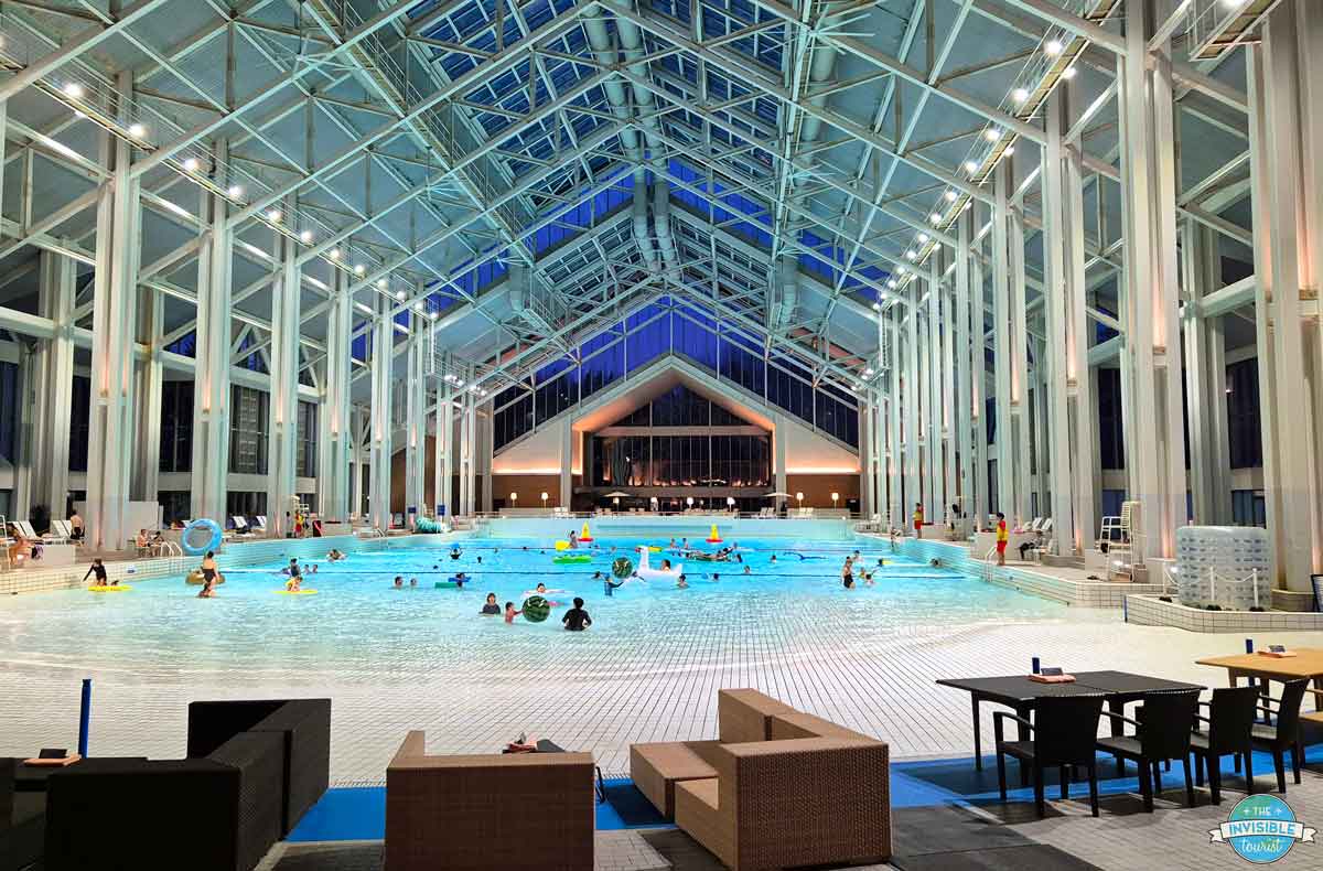 Mina-Mina Beach indoor wave pool under a glass roof at Hoshino Resorts Tomamu
