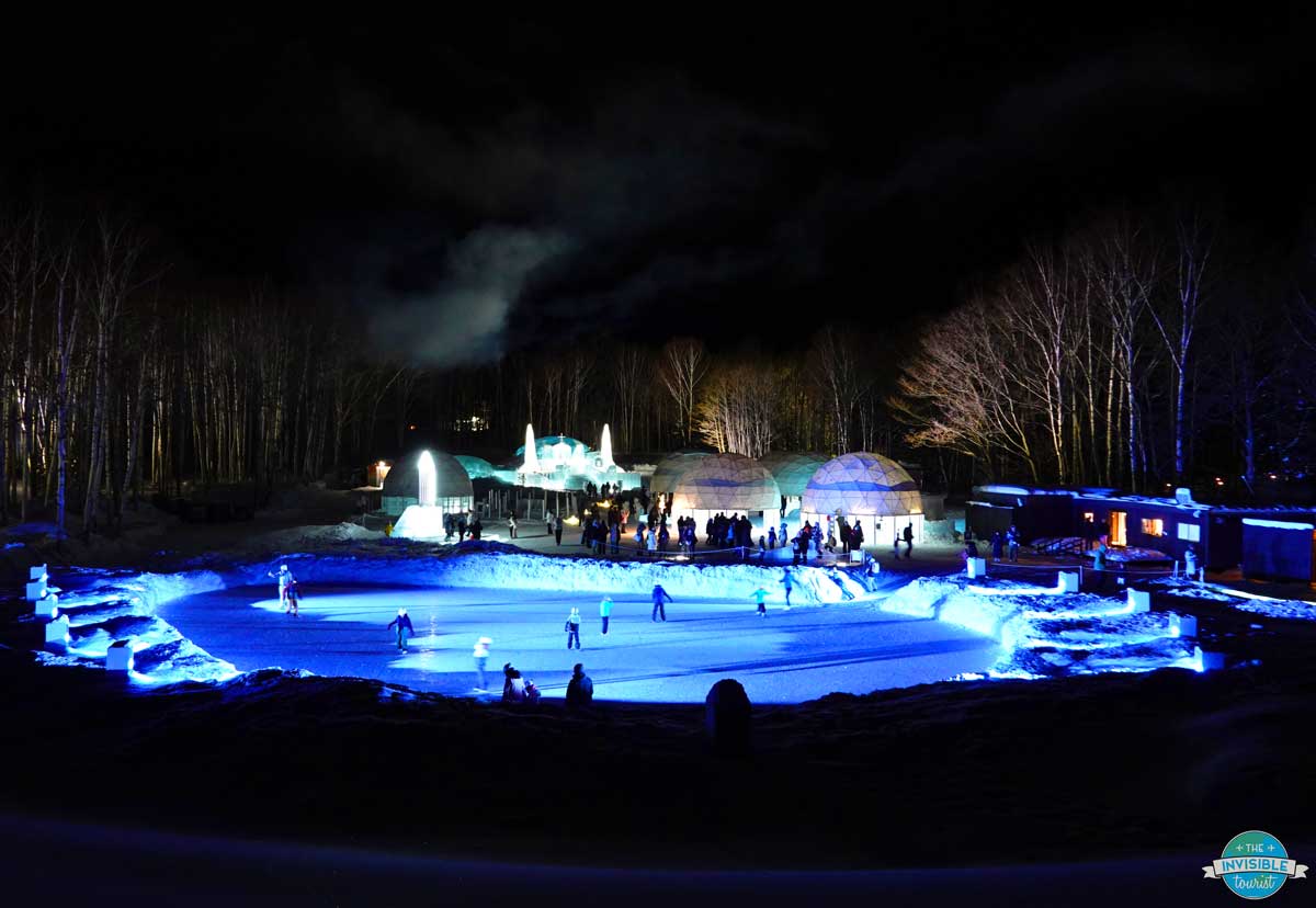 Ice Village skating rink lit up in blue at night, Hoshino Resorts Tomamu