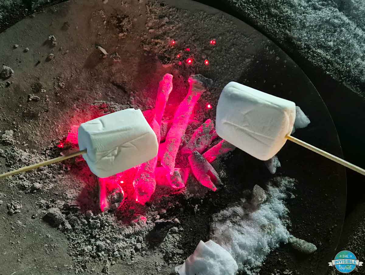 Roasting marshmallows over a fire pit at the Tomamu Ice Village