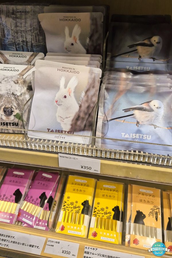 Snacks and souvenirs on the shelves of the small resort shop at Hoshino Resorts Tomamu